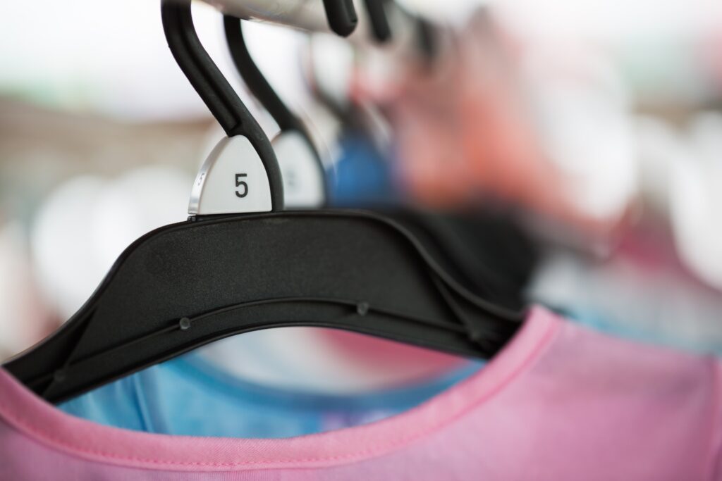 A clothing hanger displaying size of a bra clothing.